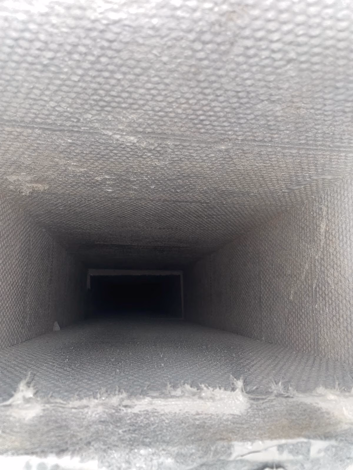 Residential full-detail air duct cleaning in East Houston, TX (77029) - vent opening
