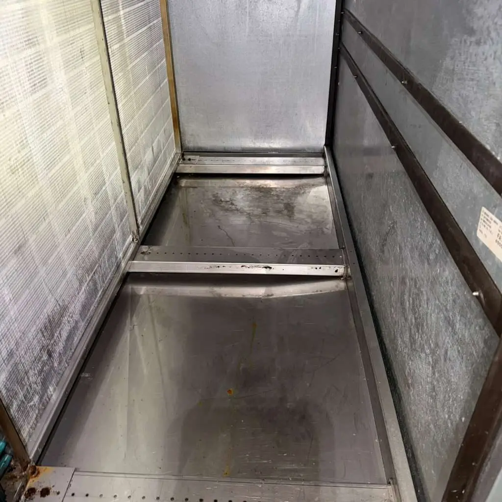 Commercial air handler coil and drain pan during cleaning in Katy, TX