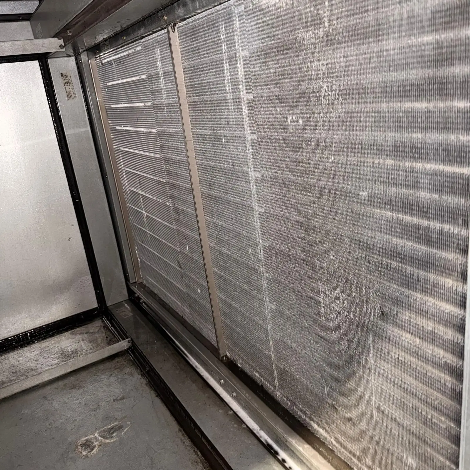 Dust-clogged evaporator coil before cleaning at the Katy Police Department in Katy, TX