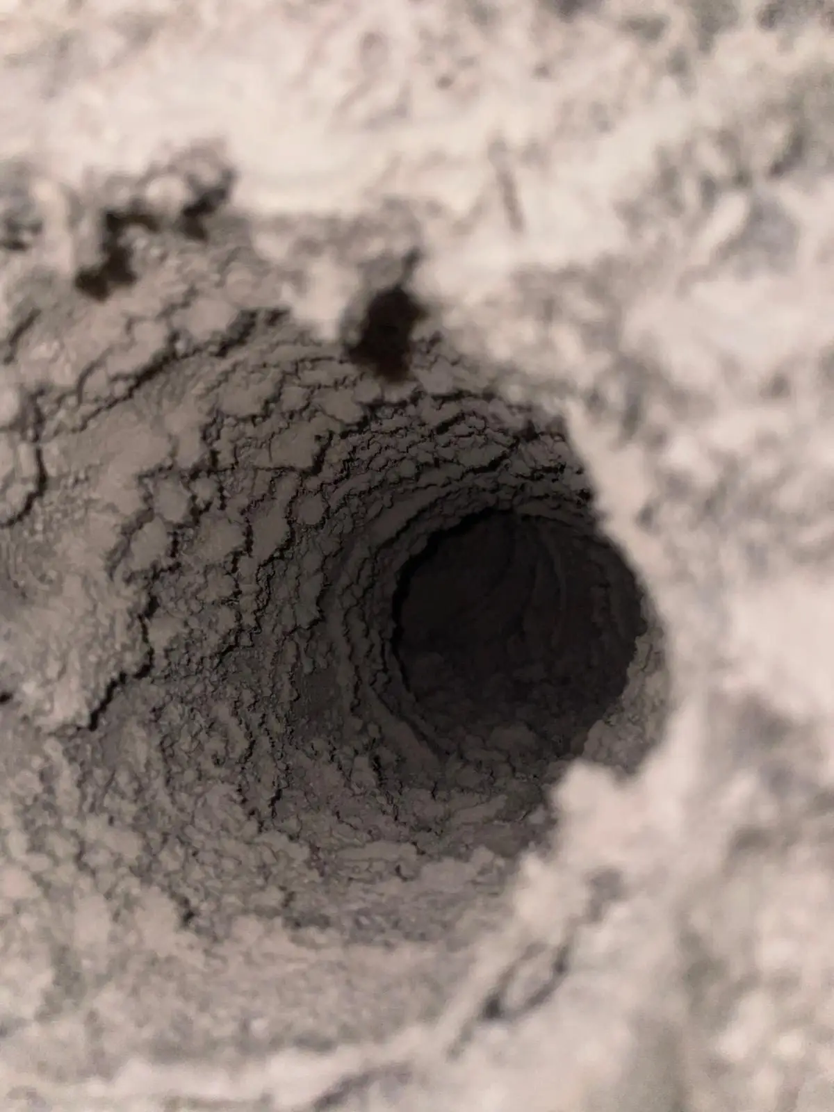 Lint buildup inside a dryer vent duct at a Houston high-rise condo