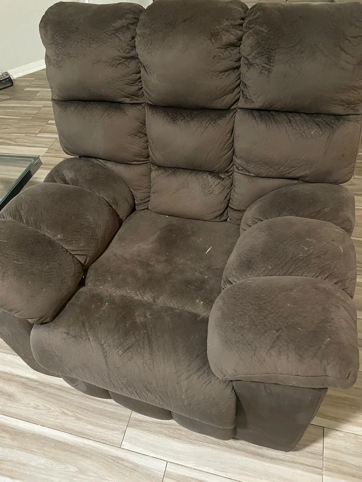 Soiled brown microfiber recliner with lint before upholstery cleaning in Katy TX 77449