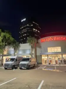 Extreme Air Duct vans parked outside David's Bridal in the Houston Galleria for an after-hours commercial duct cleaning