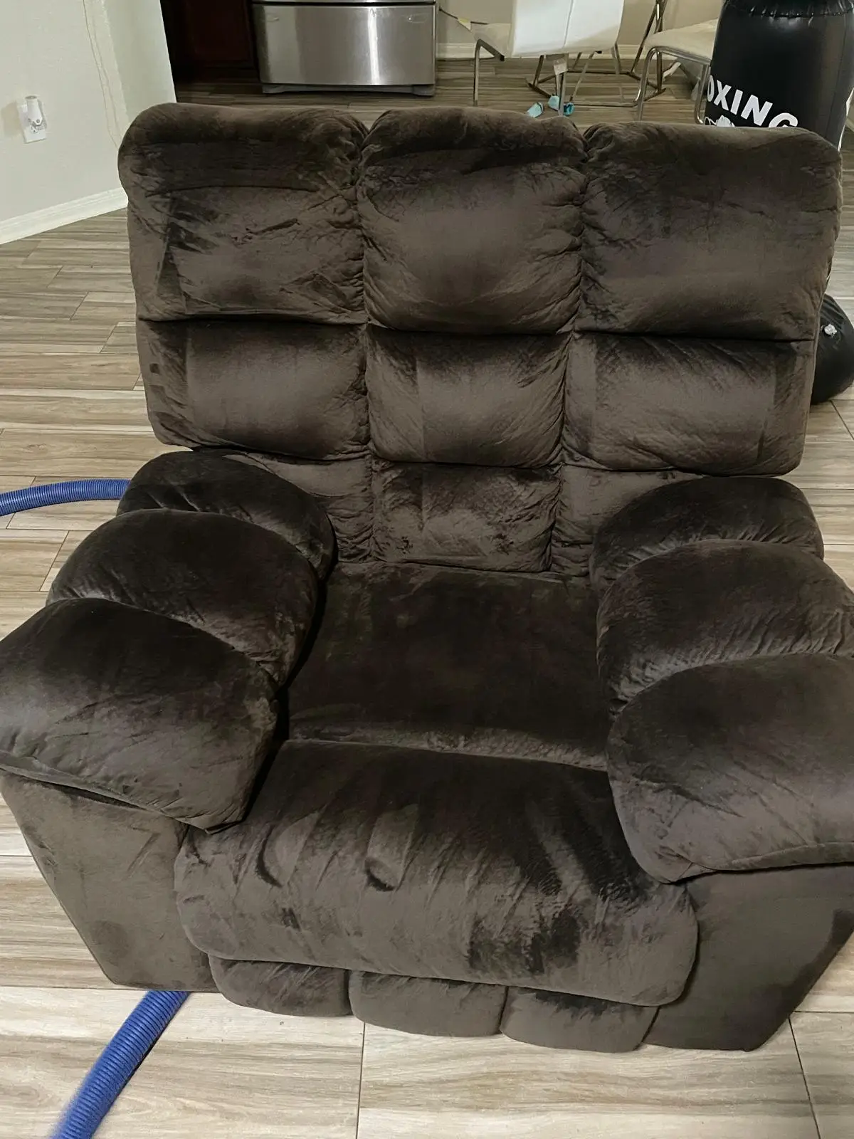 Recliner being cleaned with hot-water extraction during upholstery service, Katy TX