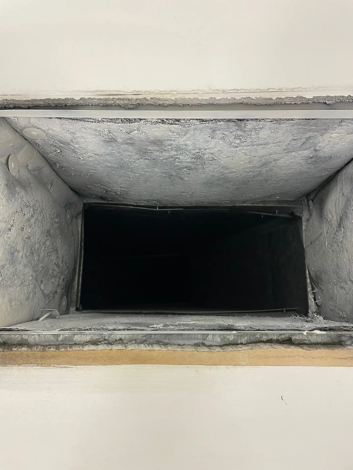 Clean supply duct boot interior after professional cleaning
