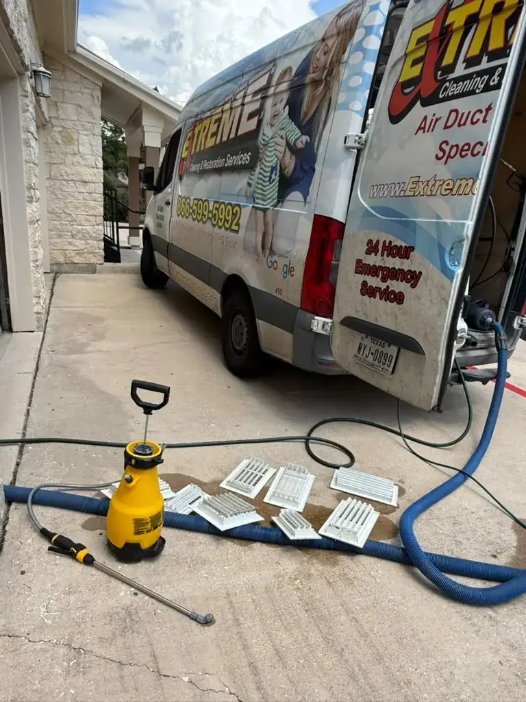 Vent covers washed at the truck during air duct cleaning in Katy, TX 77450