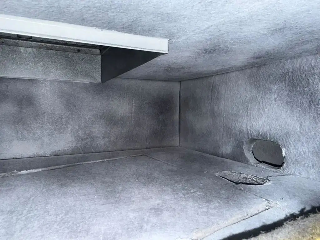 Return box interior restored to clean duct board after cleaning in Katy, TX