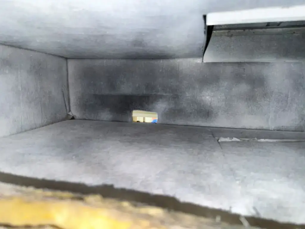 Supply plenum interior after full air duct cleaning in Katy, TX