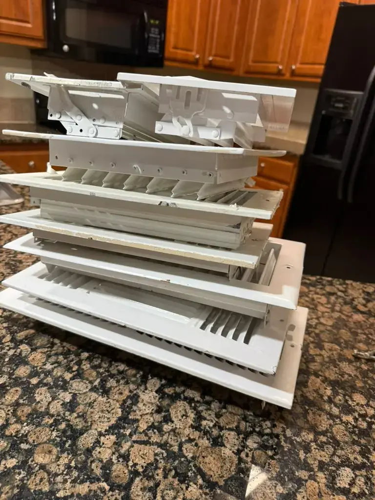 Stack of freshly washed vent covers ready to reinstall in Katy, TX 77450