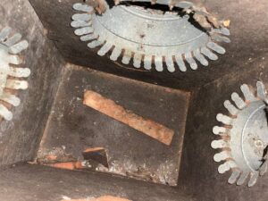 Wood scrap and brick debris left inside a return plenum in southwest Houston 77085