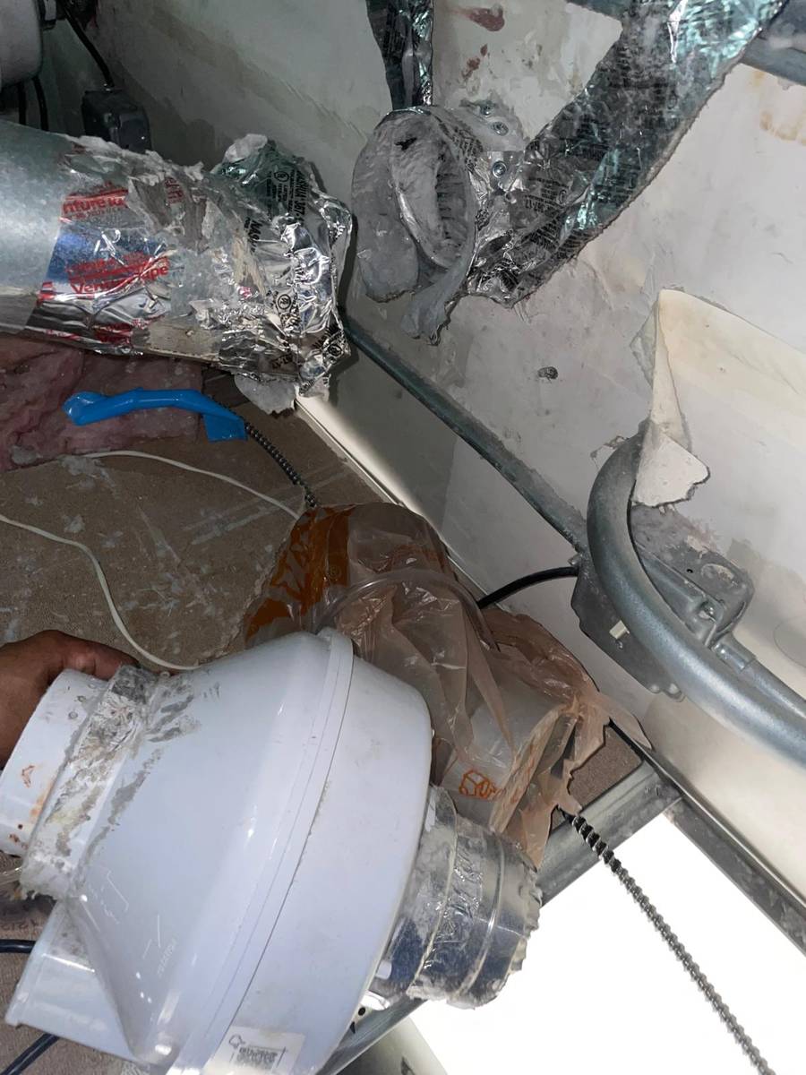 Commercial dryer vent ductwork running above a drop ceiling at a day spa in Tanglewood, Houston